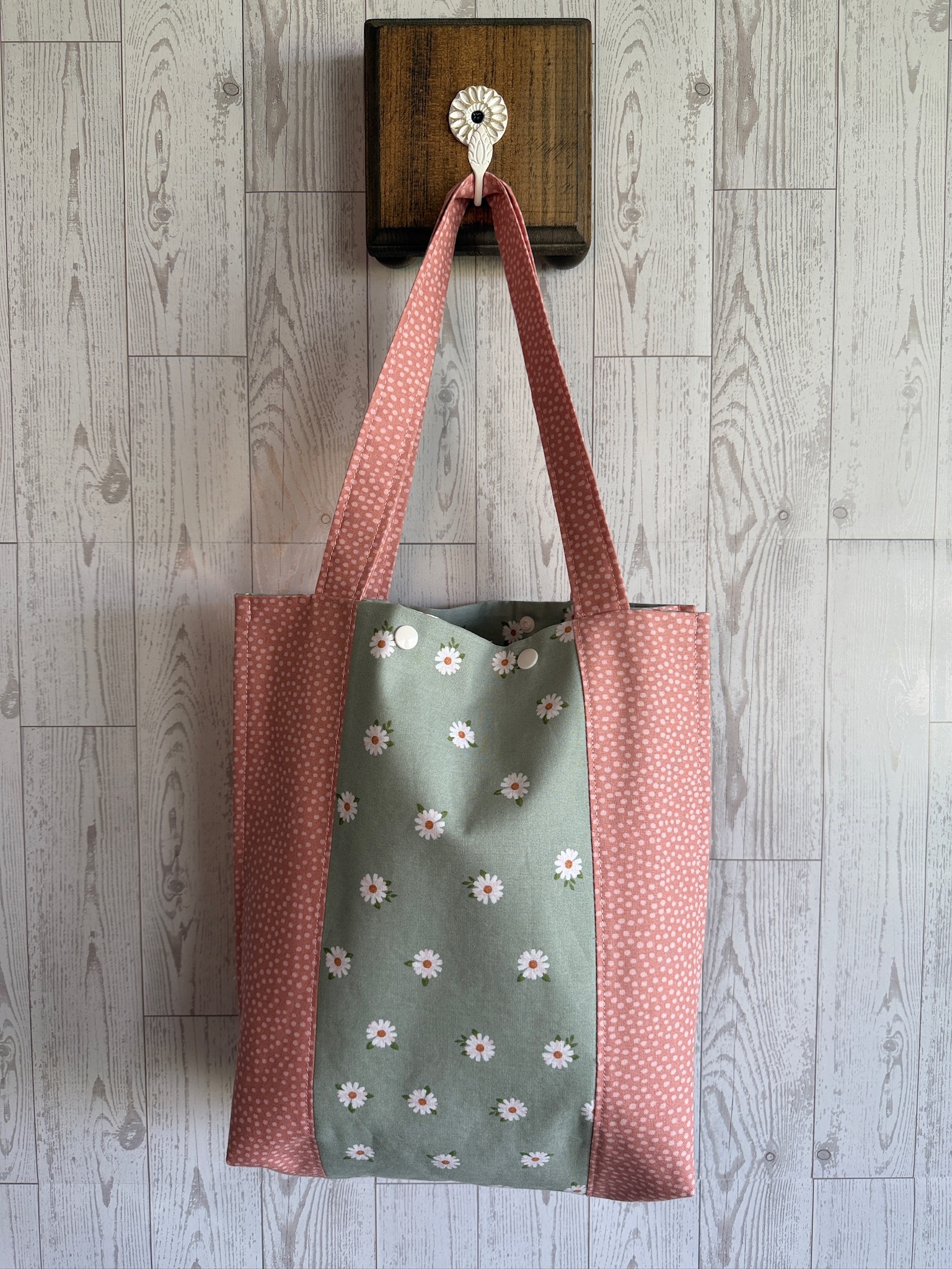 Handmade sage green daisy print tote bag with dusty rose straps and side panels