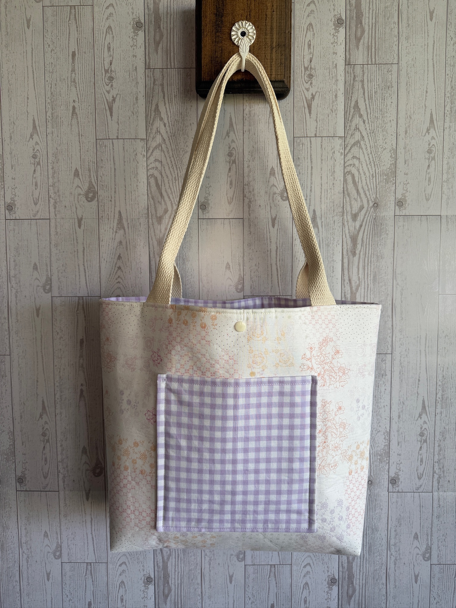 Handmade cream floral tote bag with a lavender gingham front pocket