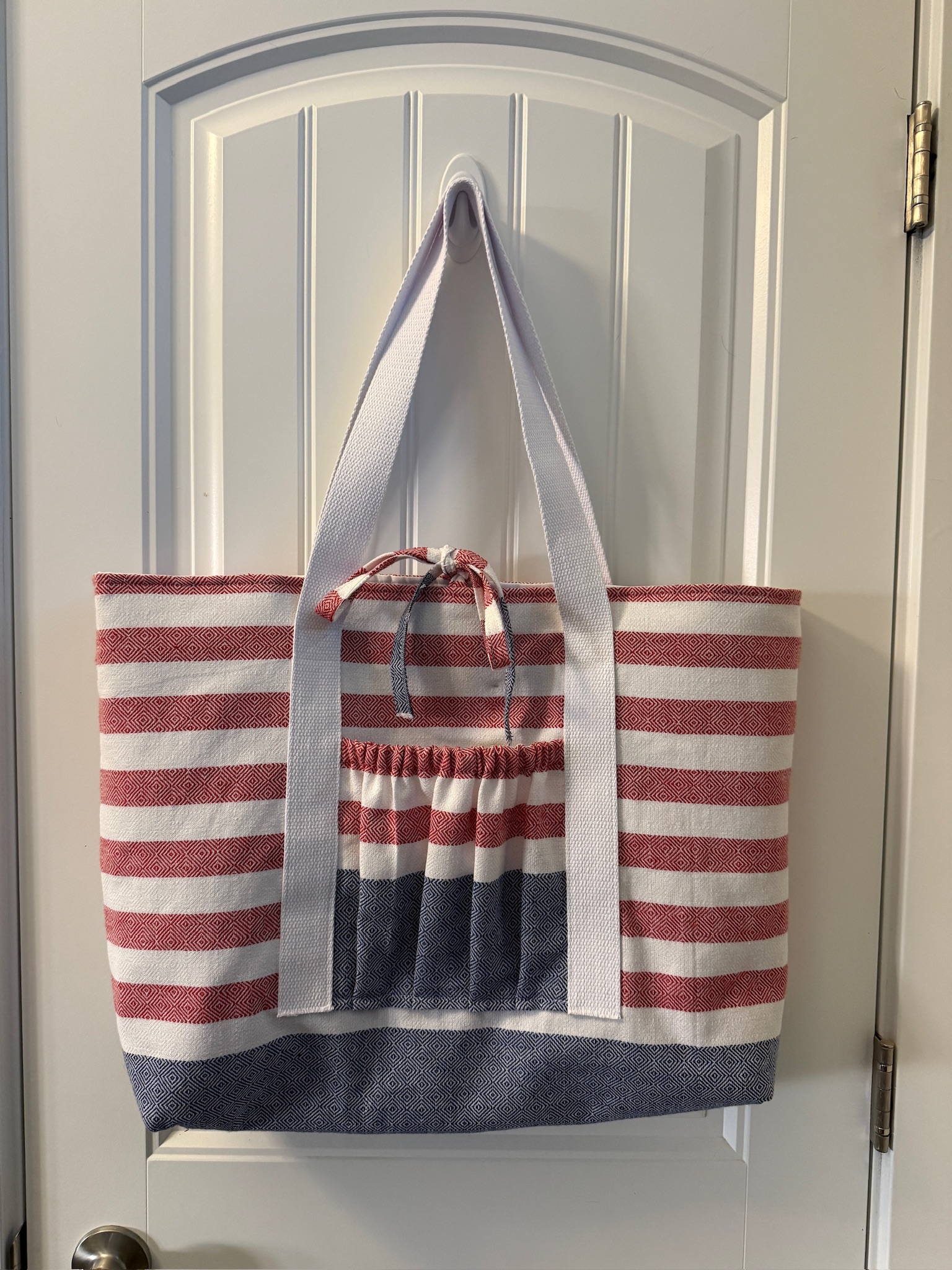 Handmade red and white striped tote bag with navy denim base and pleated patriotic front pocket