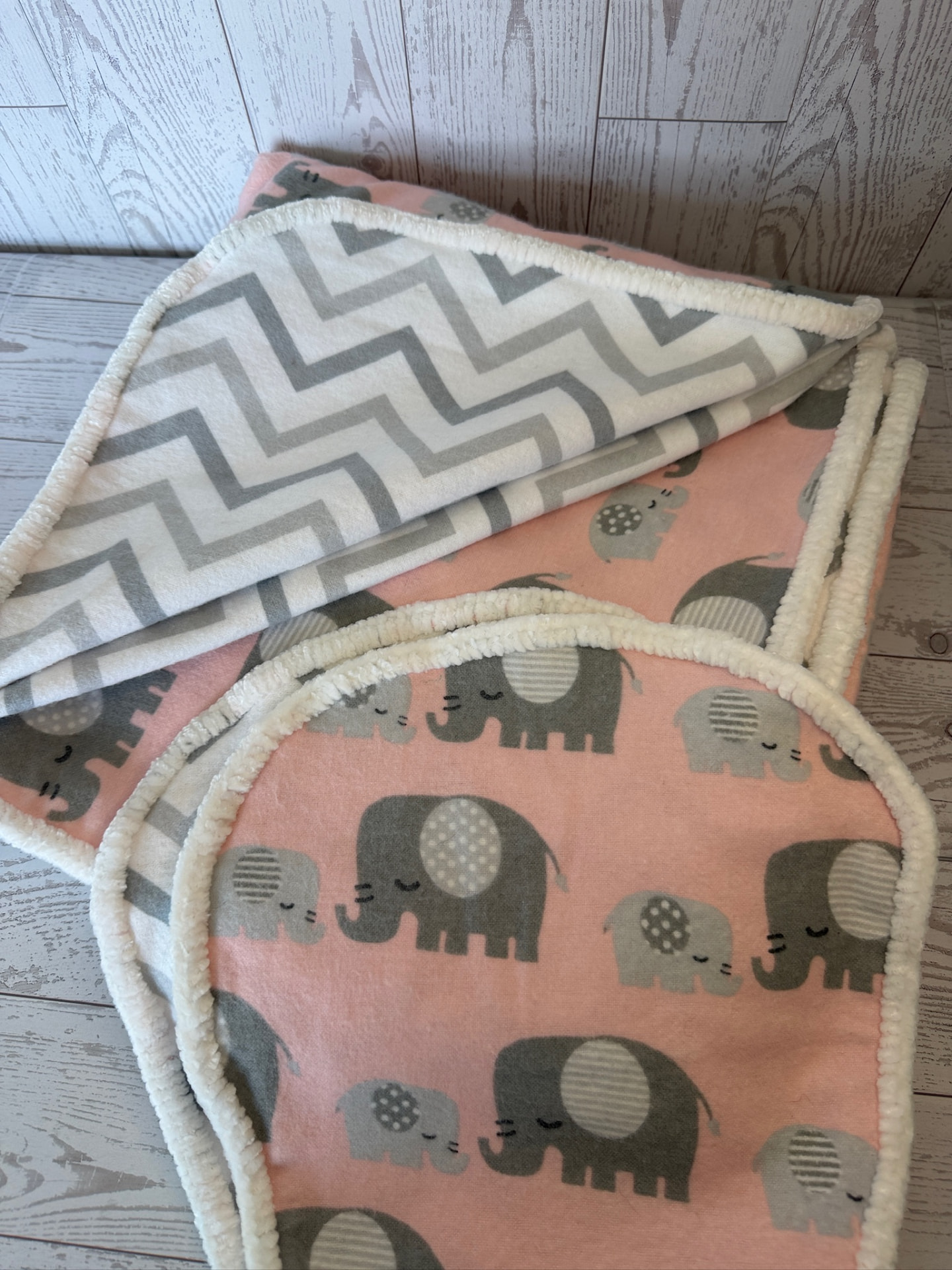 Handmade pink elephant flannel baby blanket with grey chevron reverse and cream chenille trim