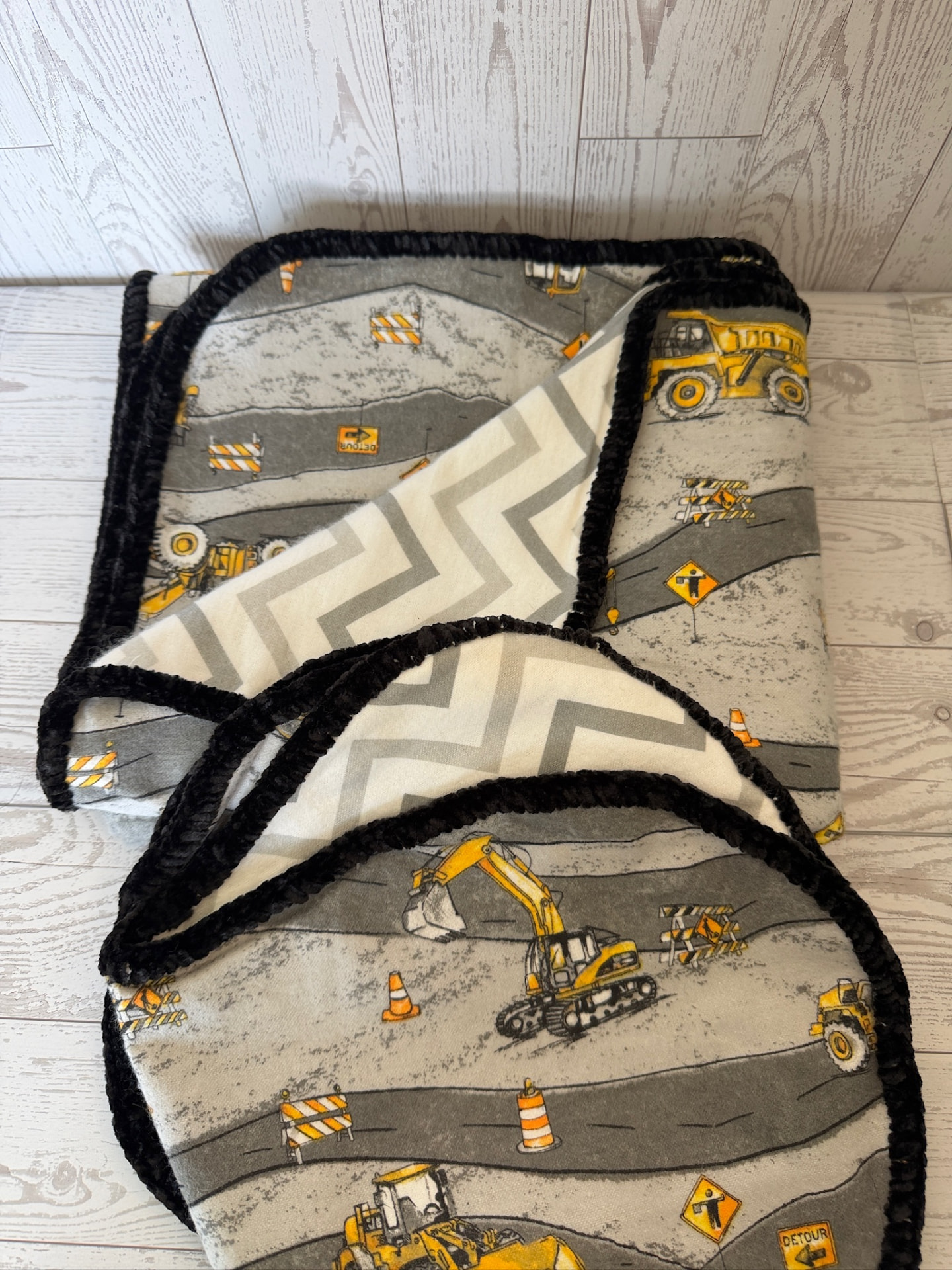 Handmade construction truck flannel baby blanket with grey chevron reverse and black chenille trim